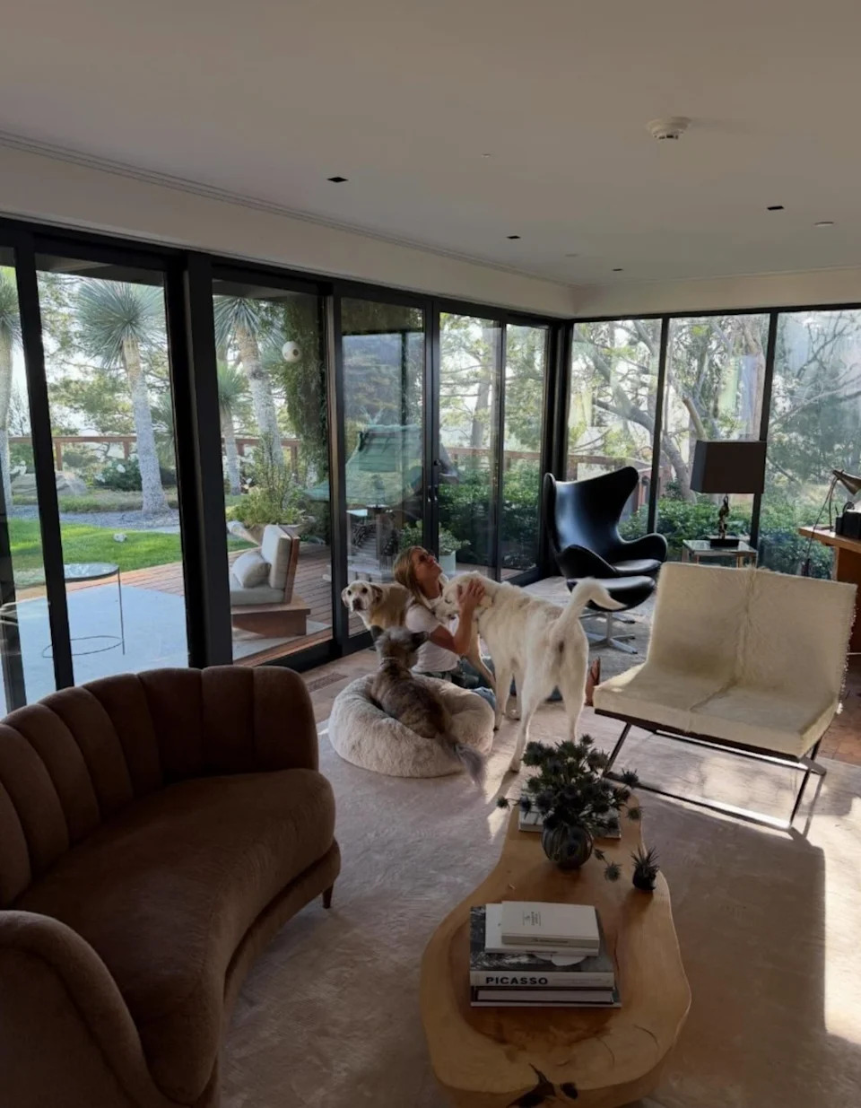 Jennifer Aniston is seen with her three dogs in a California home
