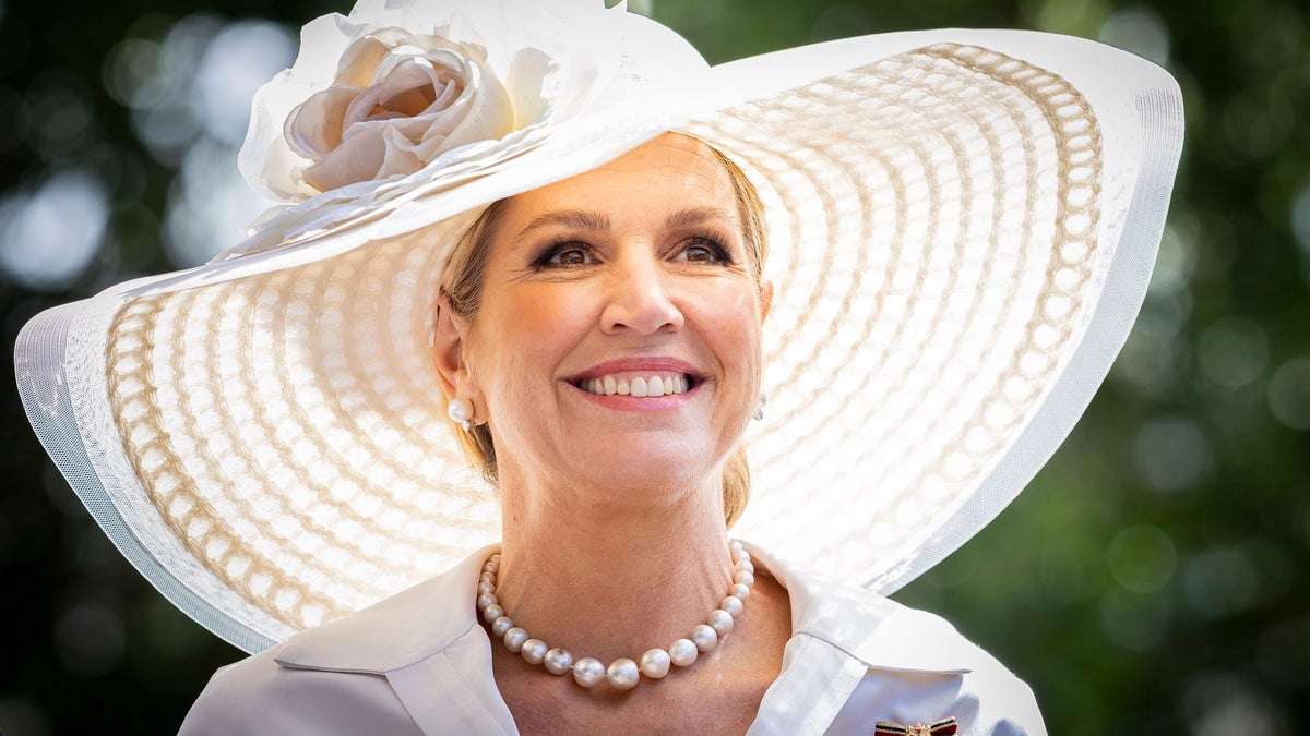 Queen Máxima embraces soft pink satin and suede with floral-inspired jewelry in London