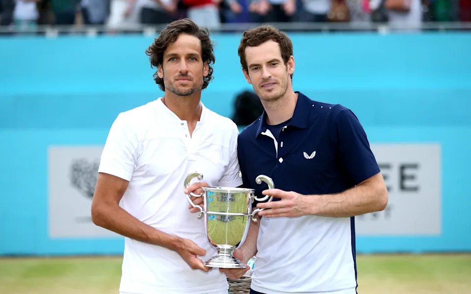Feliciano Lopez and Andy Murray (right) with the Queen's men's doubles trophy in 2019