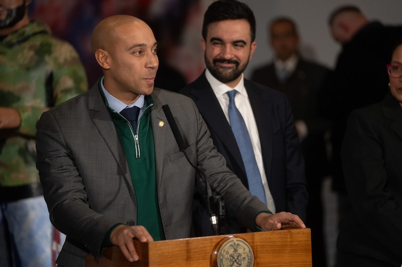 Dr. Alister Martin stands at a podium next to New York City Mayor Zohran Mamdani.