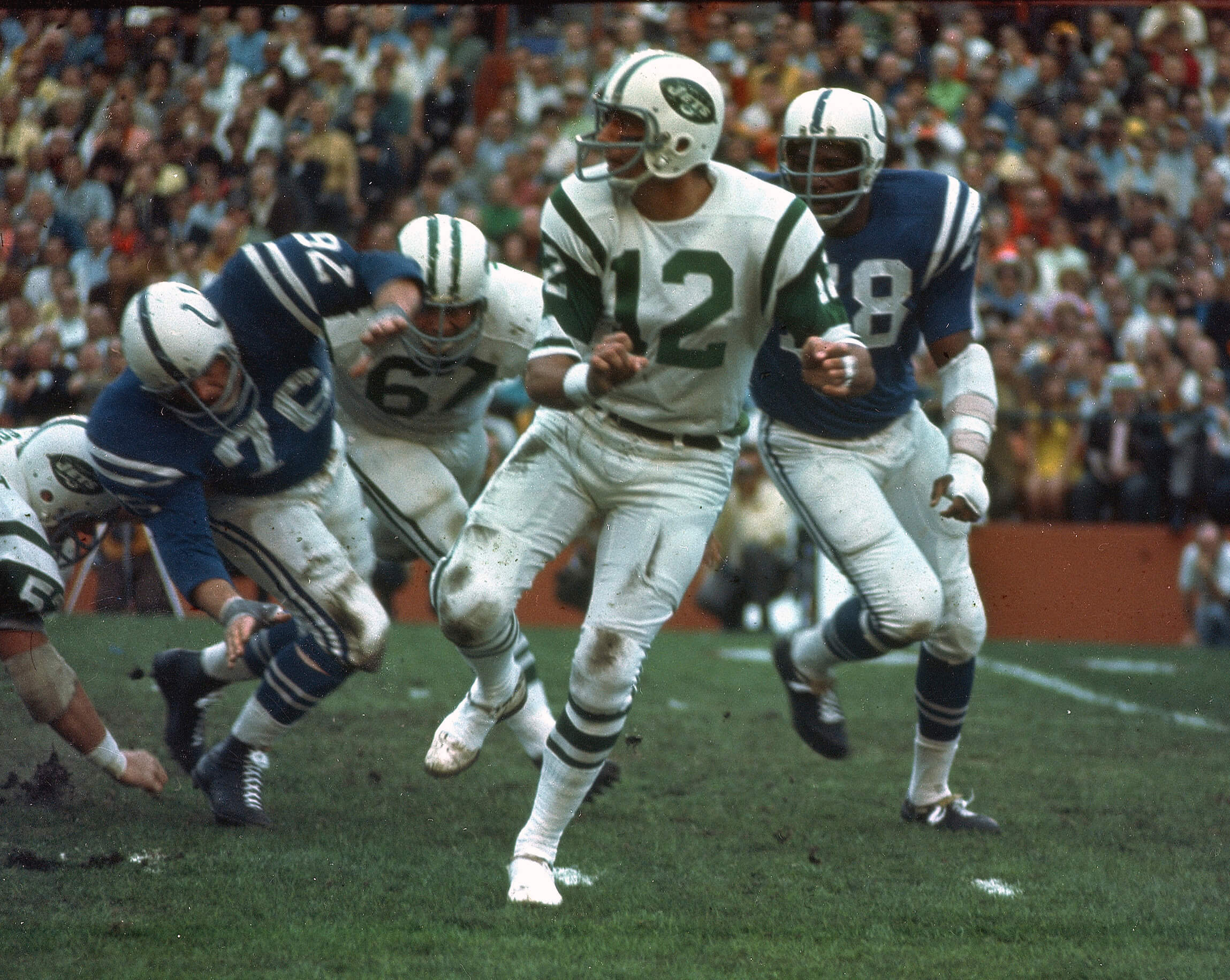Jets quarterback Joe Namath gets off a pass under pressure from the Baltimore Colts defenders during Super Bowl III in 1969. (AP Photo)