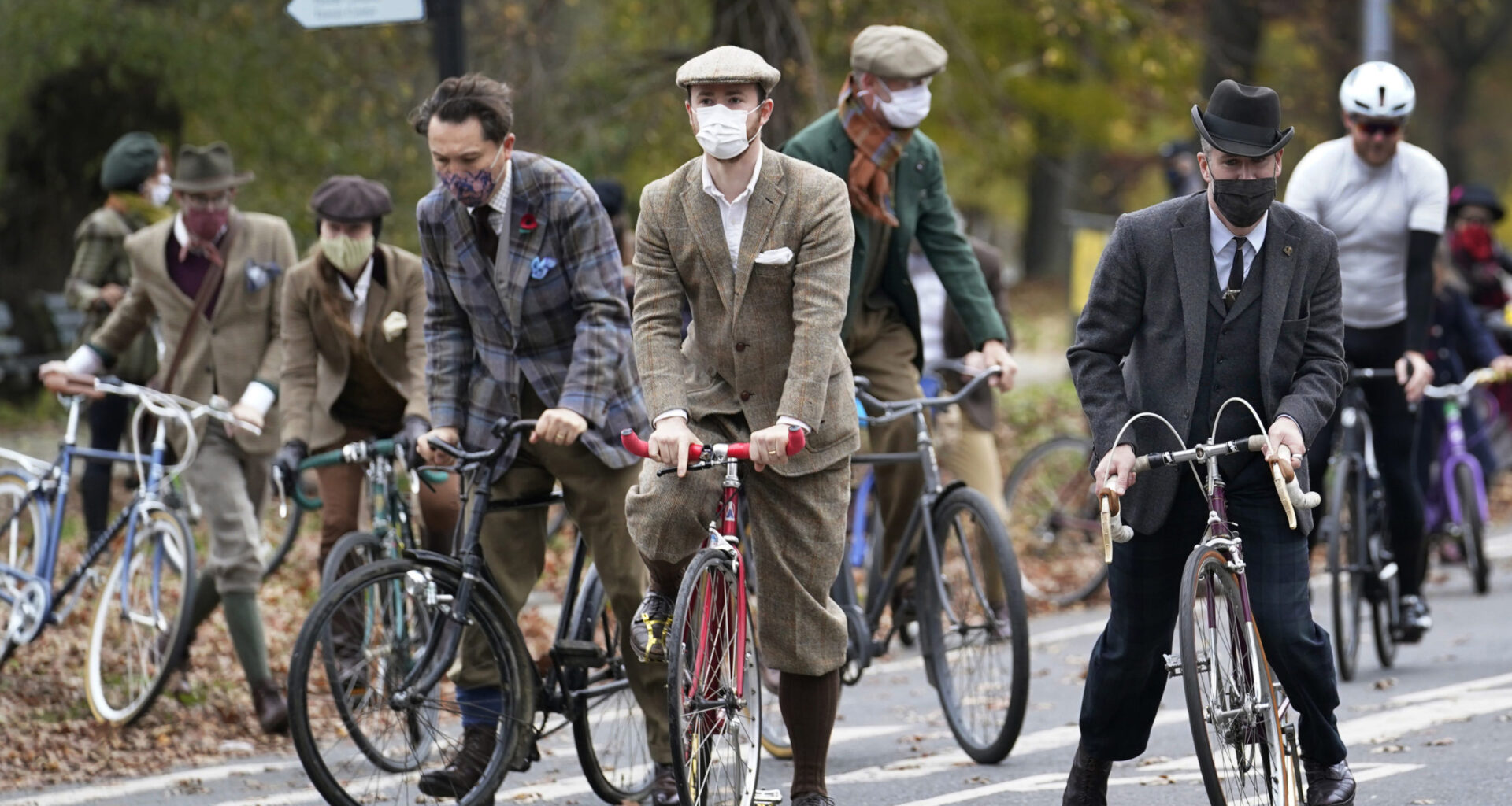 Participants in the 2020 Brooklyn Tweed Ride mount their bikes as they ride a loop in Prospect Park after a stop to sip champagne and tea at a colonnaded Grecian shelter, Sunday, Nov. 15, 2020. Photo: Kathy Willens/AP