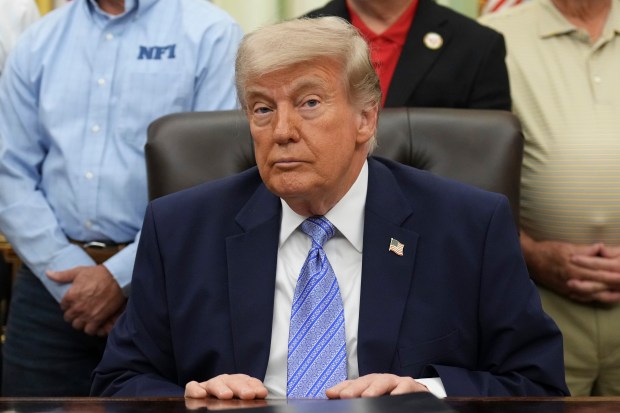 President Donald Trump attends an event about loosening a federal refrigerant rule, in the Oval Office at the White House, Thursday, May 21, 2026, in Washington. (AP Photo/Jacquelyn Martin)
