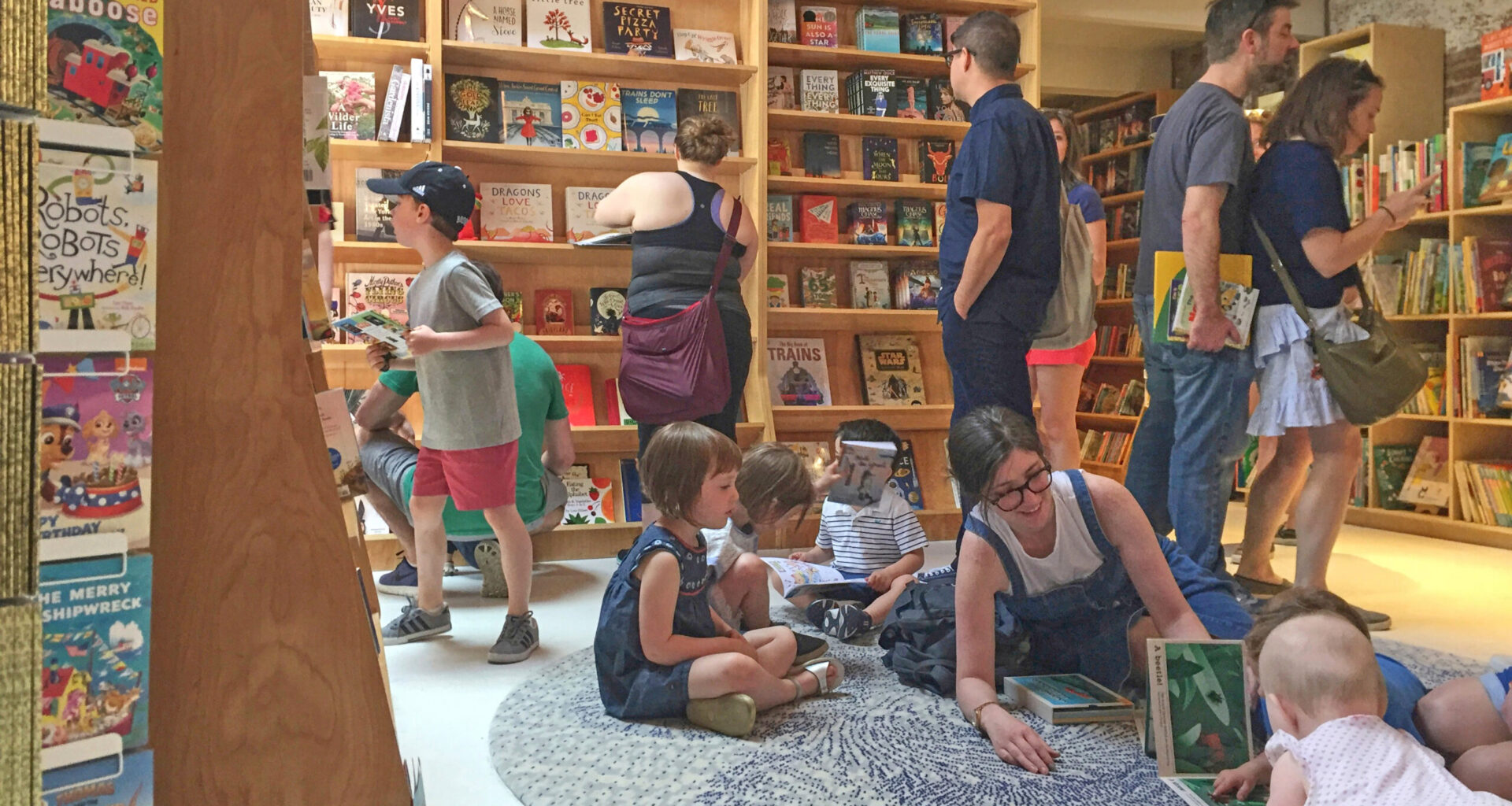 Customers appear in the children's area of the Books Are Magic bookstore, owned by author Emma Straub, in Brooklyn, on April 29, 2017. Photo: Beth J. Harpaz/AP, File