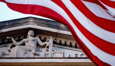 An American flag flies outside the Department of Justice in Washington. (AP Photo/Andrew Harnik, File)
