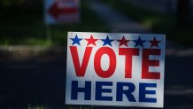 A sign directs voters to a polling place for the New Jersey primary election in Cherry Hill township, N.J., Tuesday, June 2, 2026. (AP Photo/Matt Rourke)