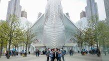FILE - Visitors peek into the museum at the 9/11 Museum and Memorial, April 29, 2021, in New York. (AP Photo/Mary Altaffer, File)