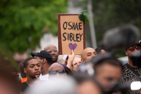 People gather at a gas station during a vigil to memorialize O'Shae Sibley, Aug. 4, 2023, in Midwood. Photo: Tracie Van Auken/AP, File