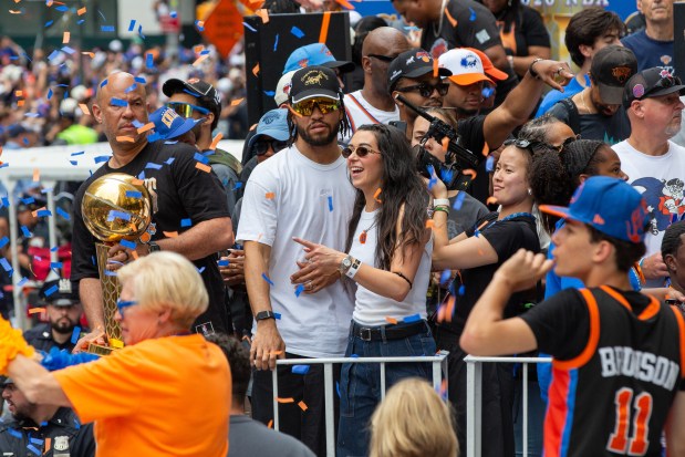 New York Knicks guard Jalen Brunson and wife Ali Brunson are in the NBA championship ticker-tape parade on Broadway, in New York's "Canyon of Heroes," Thursday, June 18, 2026. (AP Photo/Ted Shaffrey)