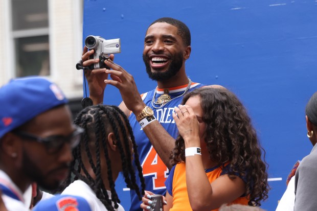 New York Knicks player Mikal Bridges celebrates the team's NBA championship during a ticker-tape parade down Lower Manhattan's "Canyon of Heroes" on Broadway, Thursday, June 18, 2026 in New York. This was the Knicks' first NBA championship in 53 years. (Jason DeCrow/Alliance for Downtown New York via AP Content Services)