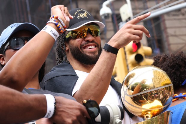 New York Knicks player Jalen Brunson celebrates the team's NBA championship during a ticker-tape parade down Lower Manhattan's "Canyon of Heroes" on Broadway, Thursday, June 18, 2026 in New York. This was the Knicks' first NBA championship in 53 years. (Jason DeCrow/Alliance for Downtown New York via AP Content Services)