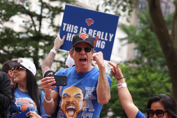 Ben Stiller celebrates the New York Knicks' NBA championship during a ticker-tape parade down Lower Manhattan's "Canyon of Heroes" on Broadway, Thursday, June 18, 2026 in New York. This was the Knicks' first NBA championship in 53 years. (Jason DeCrow/Alliance for Downtown New York via AP Content Services)