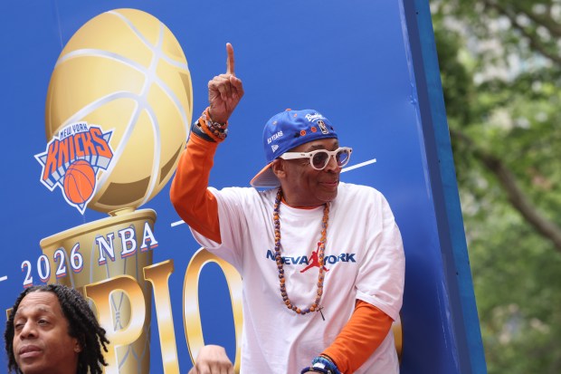 Spike Lee celebrates the New York Knicks' NBA championship during a ticker-tape parade down Lower Manhattan's "Canyon of Heroes" on Broadway, Thursday, June 18, 2026 in New York. This was the Knicks' first NBA championship in 53 years. (Jason DeCrow/Alliance for Downtown New York via AP Content Services)