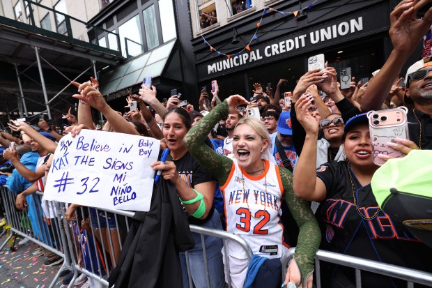 The New York Knicks celebrate their NBA championship during a ticker-tape parade down Lower Manhattan's "Canyon of Heroes" on Broadway, Thursday, June 18, 2026 in New York. This was the Knicks' first NBA championship in 53 years. (Jason DeCrow/Alliance for Downtown New York via AP Content Services)