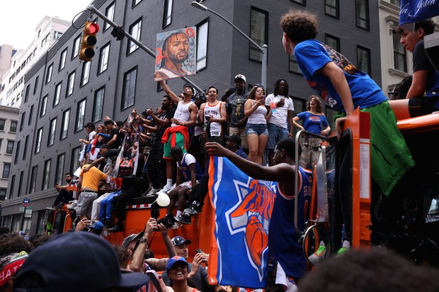 New York Knicks fans celebrate the team's NBA championship following a ticker-tape parade down Lower Manhattan's "Canyon of Heroes" on Broadway, Thursday, June 18, 2026 in New York. This was the Knicks' first NBA championship in 53 years. (Jason DeCrow/Alliance for Downtown New York via AP Content Services)