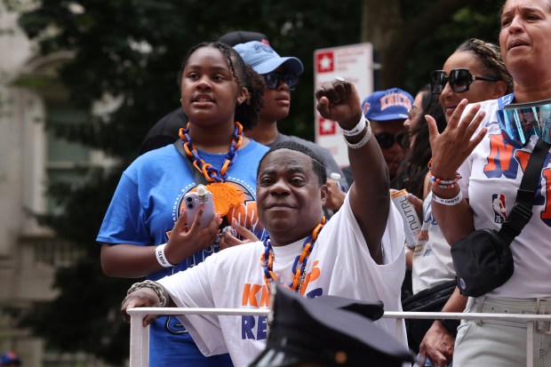 Tracy Morgan celebrates the New York Knicks' NBA championship during a ticker-tape parade down Lower Manhattan's "Canyon of Heroes" on Broadway, Thursday, June 18, 2026 in New York. This was the Knicks' first NBA championship in 53 years. (Jason DeCrow/Alliance for Downtown New York via AP Content Services)