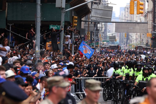 The New York Knicks celebrate their NBA championship during a ticker-tape parade down Lower Manhattan's "Canyon of Heroes" on Broadway, Thursday, June 18, 2026 in New York. This was the Knicks' first NBA championship in 53 years. (Jason DeCrow/Alliance for Downtown New York via AP Content Services)