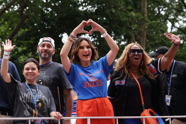 Mariska Hargitay, center, celebrates the New York Knicks' NBA championship during a ticker-tape parade down Lower Manhattan's "Canyon of Heroes" on Broadway, Thursday, June 18, 2026 in New York. This was the Knicks' first NBA championship in 53 years. (Jason DeCrow/Alliance for Downtown New York via AP Content Services)