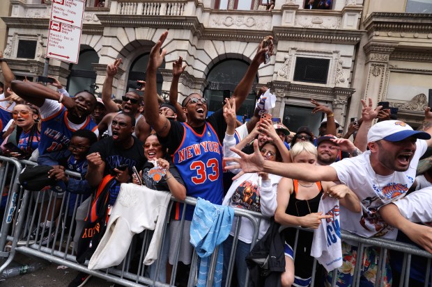 The New York Knicks celebrate their NBA championship during a ticker-tape parade down Lower Manhattan's "Canyon of Heroes" on Broadway, Thursday, June 18, 2026 in New York. This was the Knicks' first NBA championship in 53 years. (Jason DeCrow/Alliance for Downtown New York via AP Content Services)