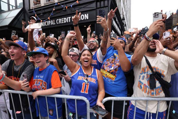 The New York Knicks celebrate their NBA championship during a ticker-tape parade down Lower Manhattan's "Canyon of Heroes" on Broadway, Thursday, June 18, 2026 in New York. This was the Knicks' first NBA championship in 53 years. (Jason DeCrow/Alliance for Downtown New York via AP Content Services)