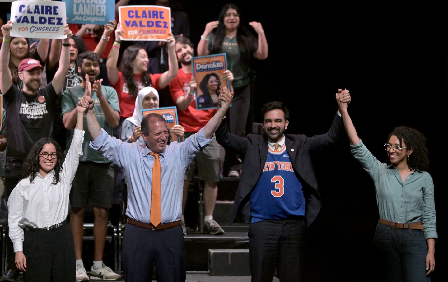 Congressional candidate Claire Valdez, Congressional candidate Brad Lander, Mayor Zohran Mamdani, and Congressional candidate Darializa Avila Chevalier raise their hands during the 'Our Team, Our Year' Get Out The Vote (GOTV) rally for local candidates ahead of next week's Primary Elections, at the Kings Theatre in the Brooklyn borough of New York City, NY, June 18, 2026.