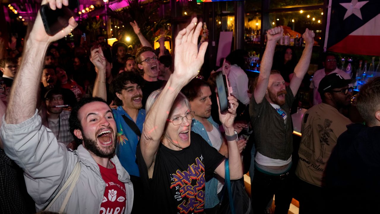 Supporters for Democratic congressional candidate Darializa Avila Chevalier celebrate during an election night watch party Tuesday, June 23, 2026, in New York. (AP Photo/Seth Wenig)