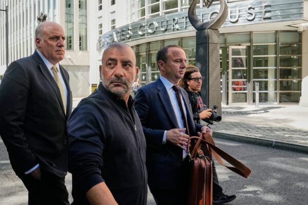 Frank Carone, second left, leaves federal court in the Brooklyn borough of New York, Wednesday, June 24, 2026. (AP Photo/Richard Drew)