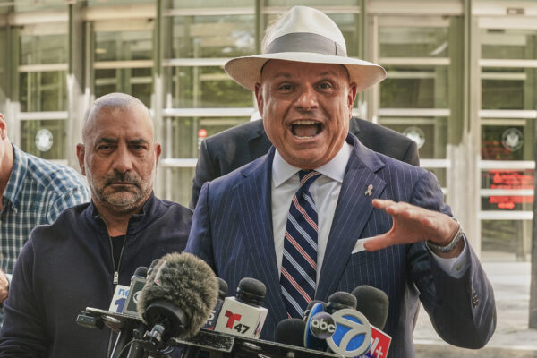 Frank Carone, left, accompanied by his lawyer Arthur Aidala, meet the media outside federal court in the Brooklyn borough of New York, Wednesday, June 24, 2026. (AP Photo/Richard Drew)