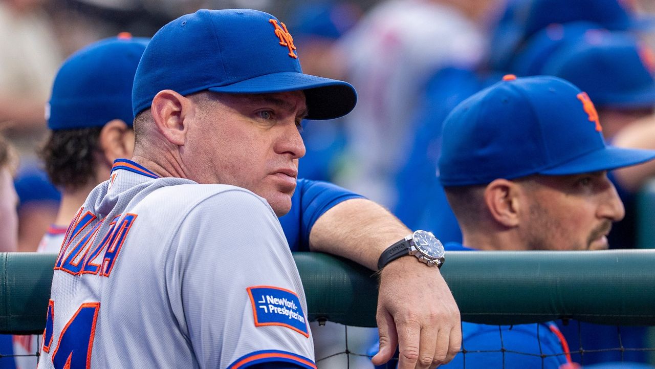 New York Mets manager Carlos Mendoza looks on during the first inning of a baseball game against the Philadelphia Phillies, Sunday, June 21, 2026, in Philadelphia.