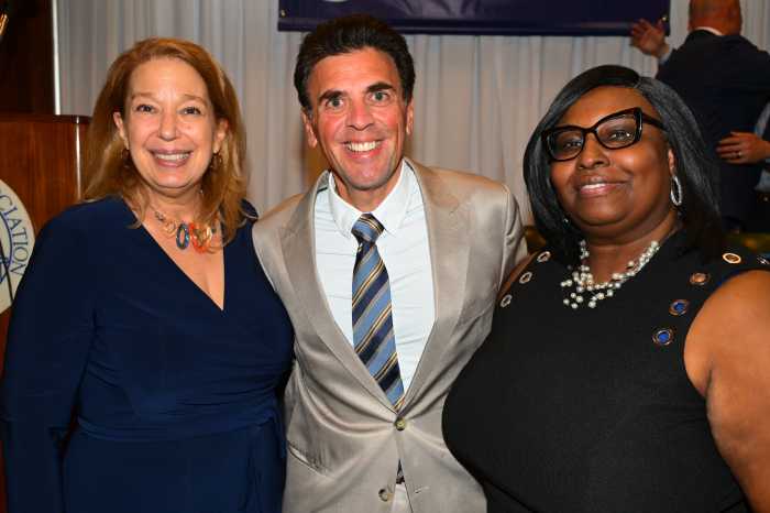 three people dressed in business clothes