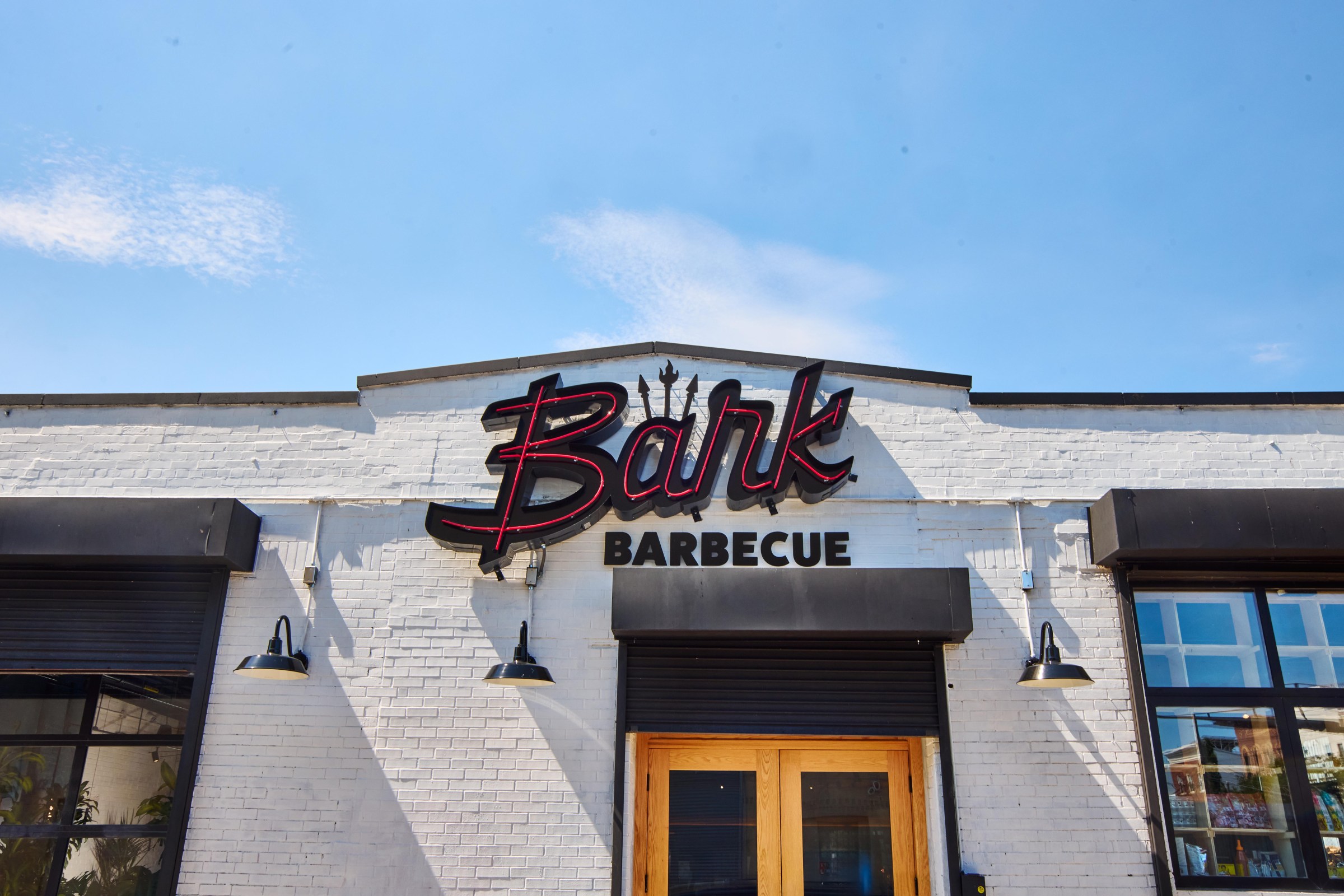 A restaurant exterior with the words Bark Barbecue.