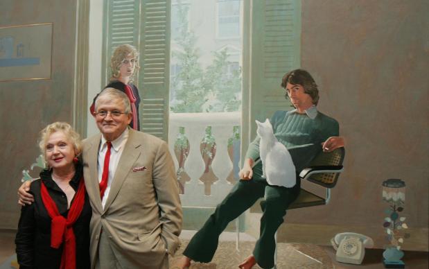 David Hockney with Celia Birtwell in front of "Mr and Mrs Clark and Percy."