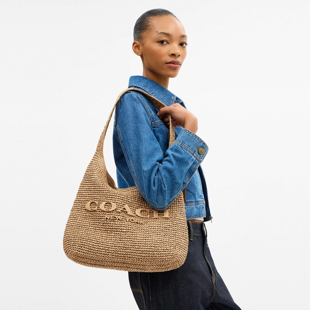 New Coach Brooklyn Straw Totes Dropped in Dark Fuchsia for Summer 2026