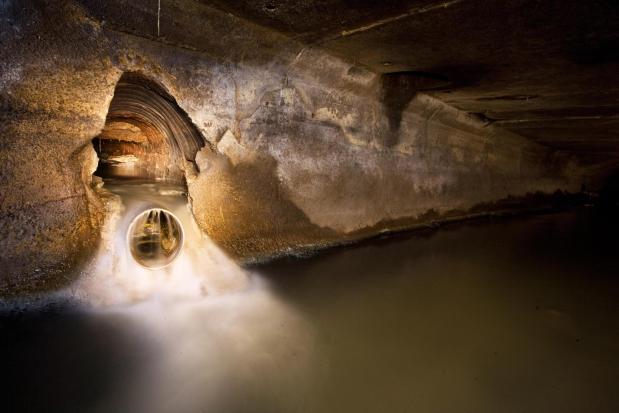 Water flows through a sewer tunnel in the borough of Manhattan in New York. 