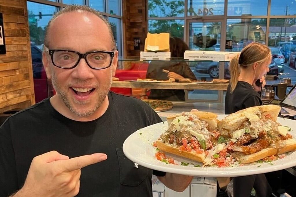 Brunio DiFabio holding a sandwich.