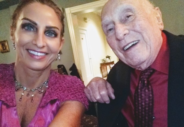 Author Alex Poppe takes a photo with her father. (Family photo)