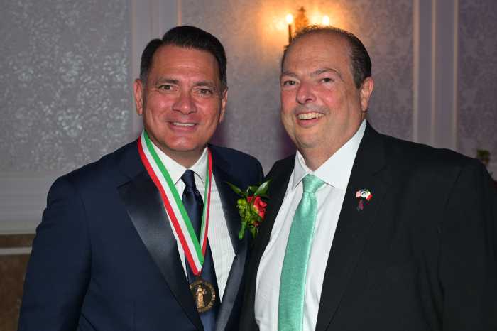 two men wearing dark suits