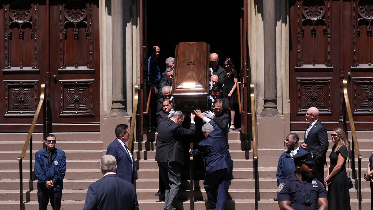 Pallbearers carry the casket after funeral services for Clive Davis at Central Synagogue in New York on Monday, June 29, 2026. (AP Photo/Adam Gray)