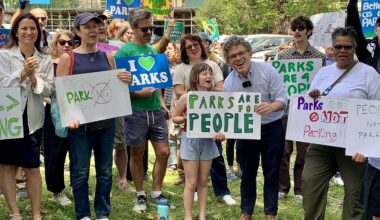 Brooklyn officials and community members gathered Sunday in Columbus Park to demand the eviction of judges from a private parking lot built on parkland. Shown center: Councilmember Lincoln Restler with P.S. 261 student Olivia. Photo: Mary Frost/Brooklyn Eagle