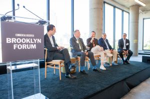 From left: REBNY's Zachary Steinberg, Kieran E. Harrington of Riseboro Community Partnership, Sam Charney of Charney Companies, Monadock Development's Kirk Goodrich, and Ofer Cohen of Ailanthus.