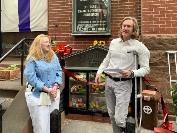 Caroline Koster and her husband James Koster, two of the founders of the Brooklyn Heights Community Fridge, led Sunday’s ribbon cutting. Photo: Mary Frost/Brooklyn Eagle
