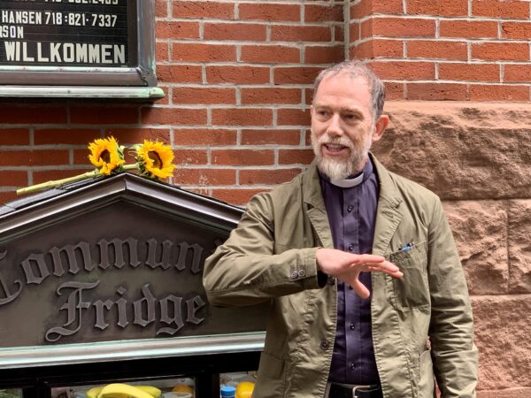 Rev. Pastor Matt Brown of the Christ the King congregation invited neighbors to visit the new Brooklyn Heights Community Fridge. Photo: Mary Frost/Brooklyn Eagle