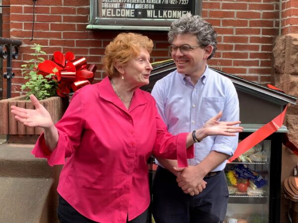 Assemblymember Jo Anne Simon and Councilmember Lincoln Restler share an enthusiastic moment at Sunday’s Brooklyn Heights Community Fridge ribbon cutting. Photo: Mary Frost/Brooklyn Eagle