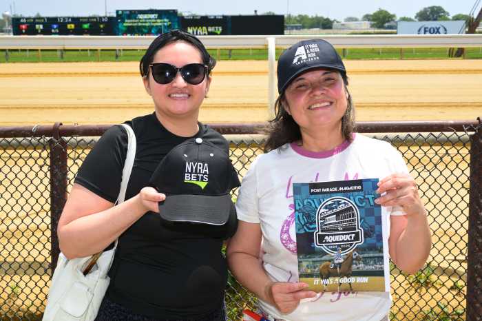 Racing fans celebrate the last day of live racing at Aqueduct. Photo by Ramy Mahmoud.