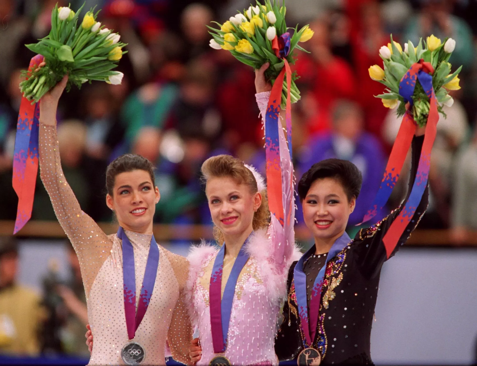 Women's podium from the 1994 Olympics (l-r) Silver: Nancy Kerrigan, Gold: Oksana Baiul, Bronze: Chen Lu.