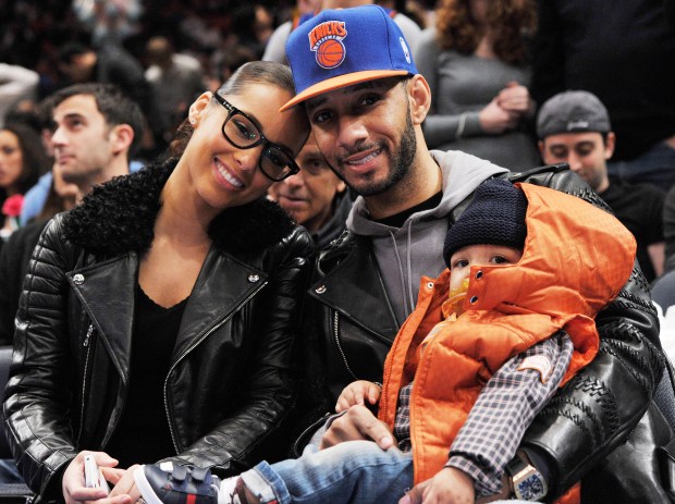 Alicia Keys and Swizz Beatz are pictured with son Egypt during a basketball game between the Boston Celtics and New York Knicks at Madison Square Garden on Dec. 25, 2011 in New York City. (Photo by Christopher Pasatieri/Getty Images)