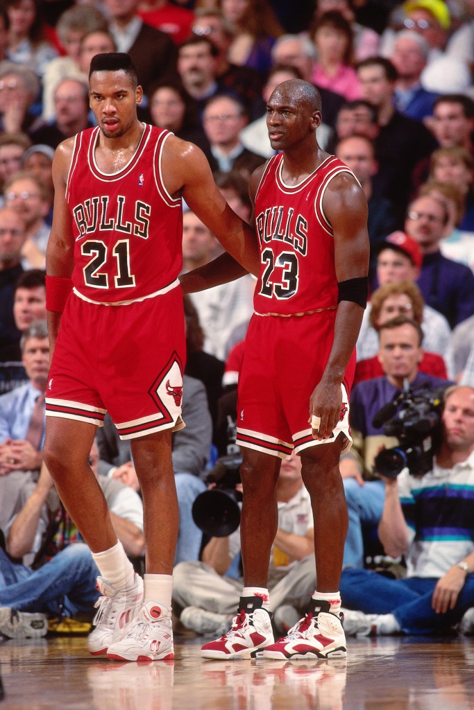 Stacey King (21) talks with Michael Jordan (23) during a Bulls game in 1991.