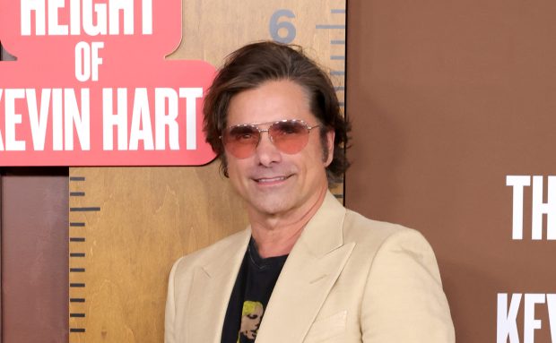 John Stamos attends The Roast of Kevin Hart red carpet during Netflix Is A Joke Fest at The Kia Forum on May 10, 2026 in Inglewood, California. (Photo by Kevin Winter/Getty Images)