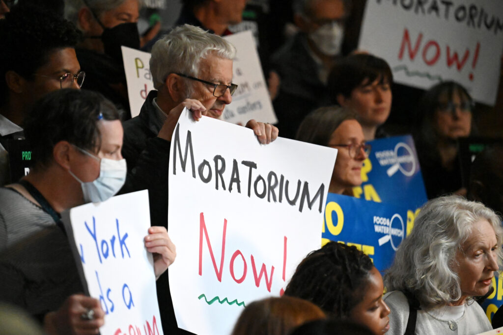 Environmental advocates and lawmakers hold a rally in support of the data center moratorium legislation on May 13 at the Capitol in Albany, N.Y. Credit: Will Waldron/Albany Times Union via Getty Images