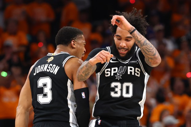 SAN ANTONIO, TEXAS - JUNE 03: Keldon Johnson #3 and Julian Champagnie #30 of the San Antonio Spurs react during the second quarter against the New York Knicks in Game One of the 2026 NBA Finals at Frost Bank Center on June 03, 2026 in San Antonio, Texas. NOTE TO USER: User expressly acknowledges and agrees that, by downloading and or using this photograph, User is consenting to the terms and conditions of the Getty Images License Agreement. (Photo by Gregory Shamus/Getty Images)